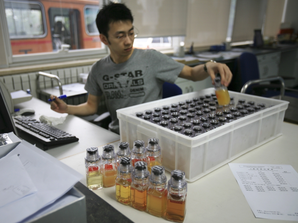 New analysis of stored samples taken from athletes at the Beijing and London Summer Olympics has turned up 45 cases of banned substances. Here urine samples are recorded upon arriving at the China Anti Doping Agency in Beijing in 2008