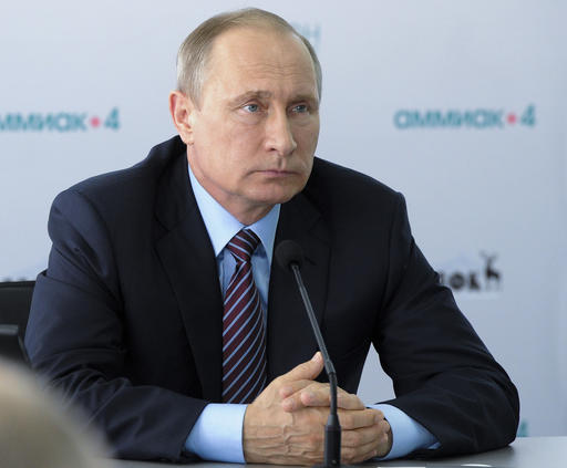 Russian President Vladimir Putin attends a meeting with local officials in Velikiy Novgorod Russia Friday