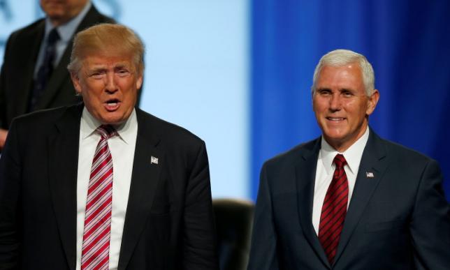 U.S. Republican presidential nominee Donald Trump and vice presidential nominee Mike Pence arrive to speak at the Veterans of Foreign Wars Convention in Charlotte North Carolina