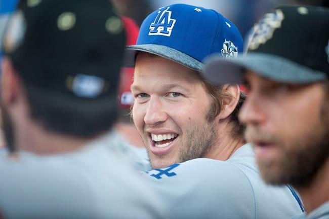 Los Angeles Dodgers&#39 Clayton Kershaw laughs with teammates during the 2016 MLB All Star Game at Petco Park in San Diego Tuesday