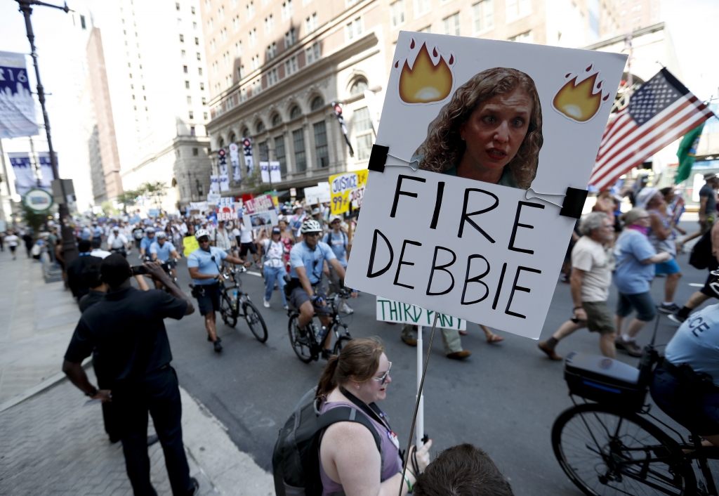 A supporter of Sen. Bernie Sanders holds up a sign on July 24 in Philadelphia calling for Debbie Wasserman Schultz chairwoman of the Democratic National Committee to be fired. Leaked e-mails showed that the DNC secretly sought to help Hillary Clinton