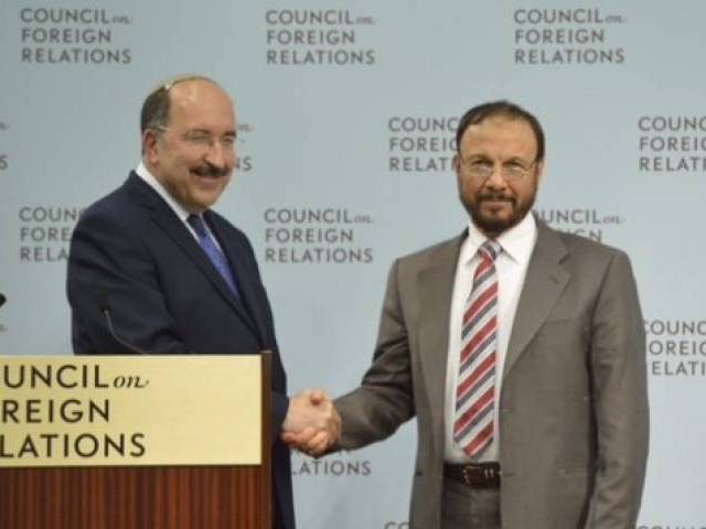 Israel’s Foreign Ministry Director General Dore Gold and former Saudi general Anwar Eshki shake hands in Washington DC