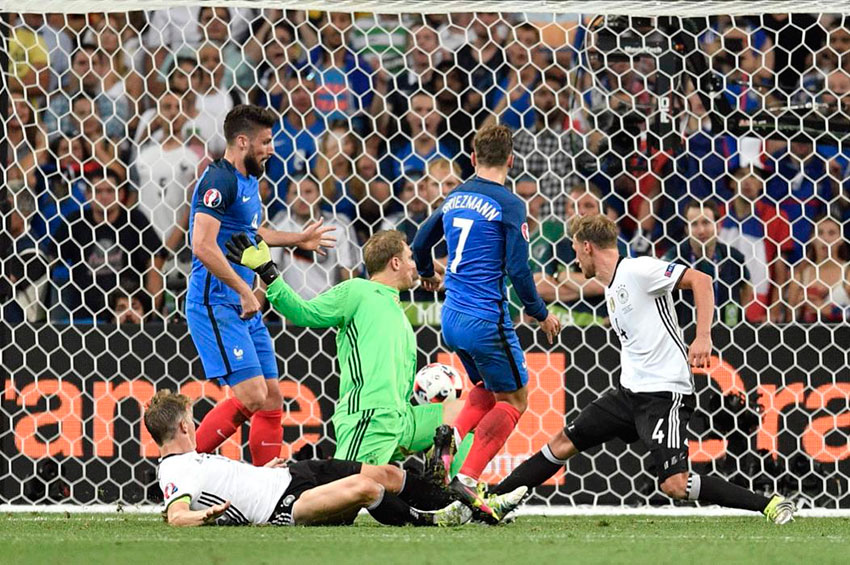 France's Antoine Griezmann center scores his side’s second goal during the Euro 2016 semifinal soccer