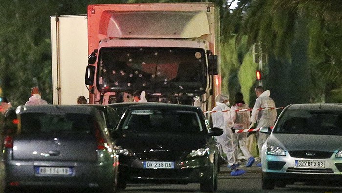 The truck which slammed into revelers late Thursday July 14 is seen near the site of an attack in the French resort city of Nice southern France Friday