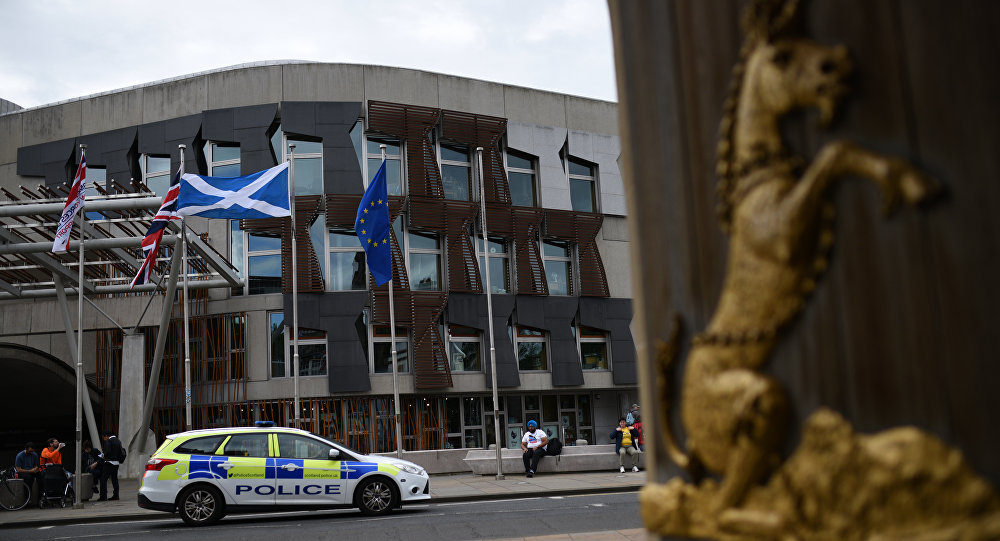 The Union flag  the Scottish Saltire flag and the European Union flag fly outside the Scottish Parliament building in Edinburgh Scotland