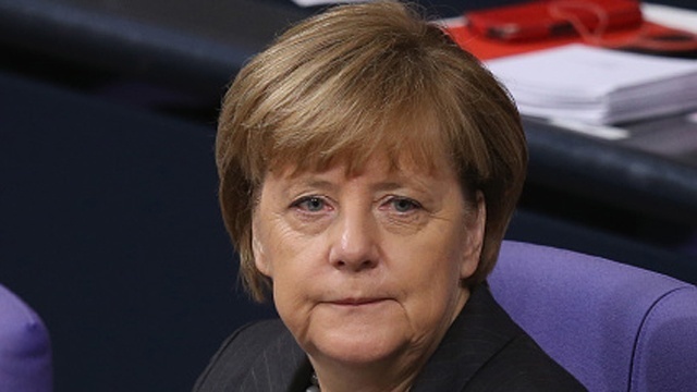 Germany's Merkel stands by refugee policy after attacks