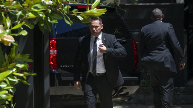 Secret Service stand guard around a Secret Service vehicle outside Hillary Clinton's home in Washington on Saturday