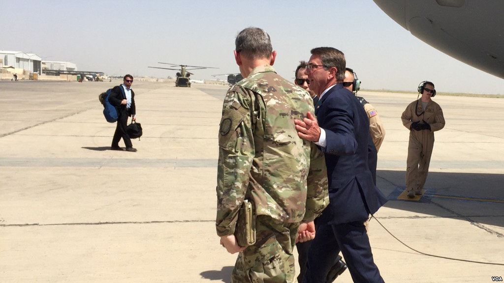 Secretary of Defense Ash Carter is greeted by General Mac Farland in Baghdad