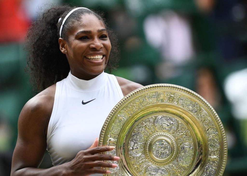 545686370-player-serena-williams-poses-with-the-winners-trophy