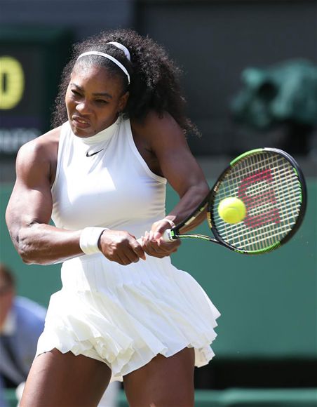 Serena Williams returns a shot in the game