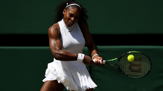 LONDON ENGLAND- JULY 07 Serena Williams of The United States plays a backhand during the Ladies Singles Semi Final match against Elena Vesnina of Russia on day ten of the Wimbledon Lawn Tennis Championships at the All England Lawn Tennis and Croquet Cl