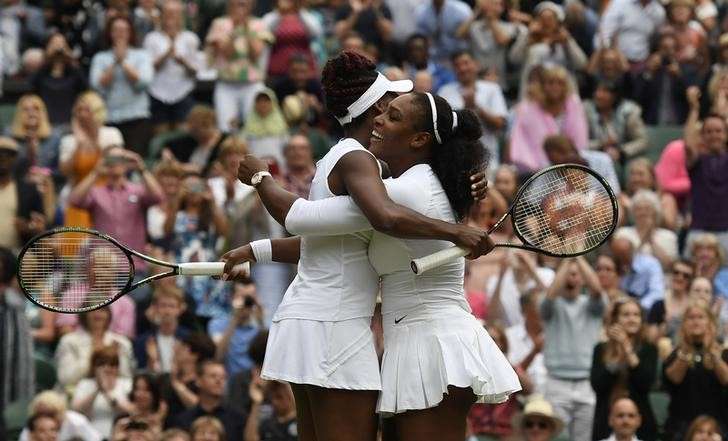 Britain Tennis- Wimbledon- All England Lawn Tennis & Croquet Club Wimbledon England- 9/7/16 USA's Serena Williams and Venus Williams celebrate winning their womens doubles final against Hungary's Timea Babos and Kazakhstan's Yaroslava Shvedova REUTER