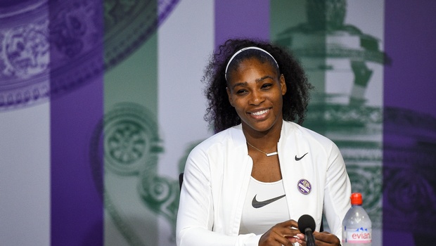 Serena Williams of the U.S smiles during a press conference after winning the women's singles final against Angelique Kerber of Germany pn day thirteen of the Wimbledon Tennis Championships in London Saturday