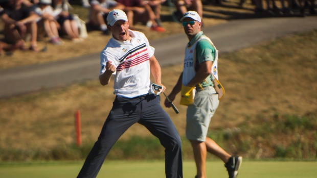 Jared du Toit of Canada reacts after sinking an eagle on 18 at the 2016 Canadian Open in Oakville Ont. on Saturday