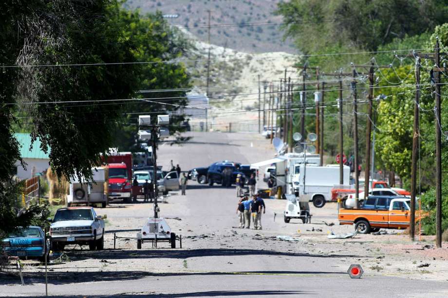 Police investigate shrapnel from a Wednesday night bombing that killed one person on 5th Street in Panaca Nev. on Thursday