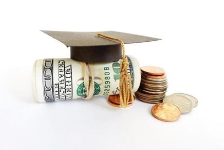 Mini graduation mortar board on cash and coins; Shutterstock ID 235111564 PO OPED