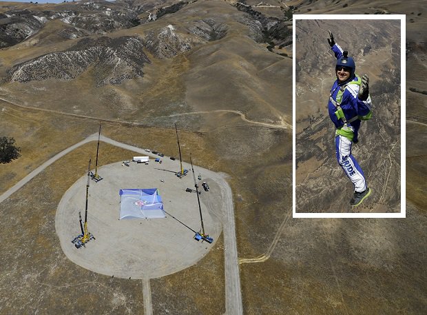 Skydiver Luke Aikins inset smiles as he free falls in a practice jump in preparation for his historic leap