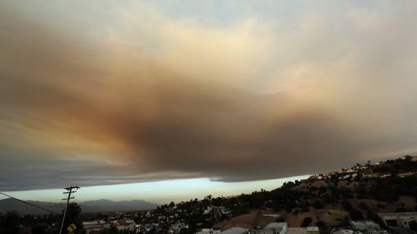 Smoke from a wildfire looms over Santa Clarita