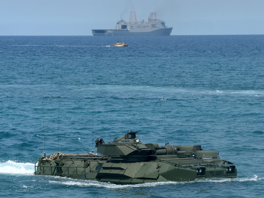 A U.S. Marine amphibious assault vehicle makes its way to shore after leaving an amphibious transport dock ship during a landing exercise on a beach at San Antonio in the Philippines&#039 Zambales Province