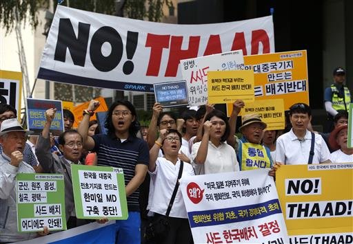 South Koreans shout slogans during a rally to denounce deploying the Terminal High Altitude Area Defense or THAAD near U.S. Embassy in Seoul South Korea Monday