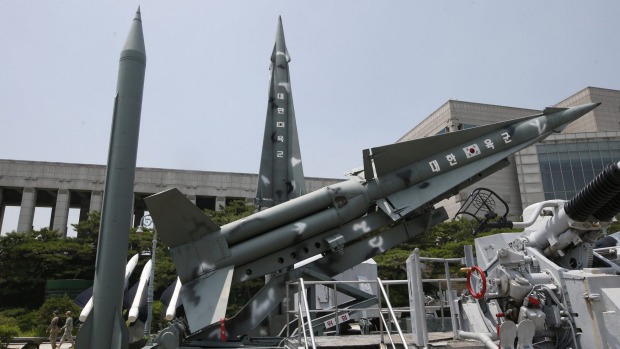 South Korea's mock missiles are displayed next to North Korea's mock Scud-B left at the Korea War Memorial Museum in Seoul