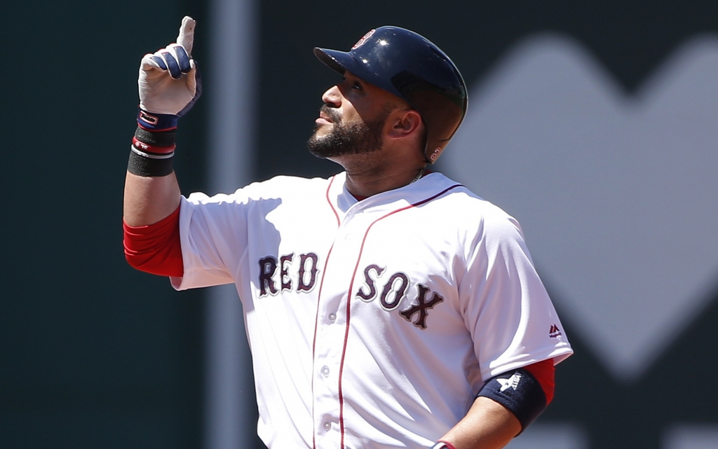 Boston Red Sox's Sandy Leon stands on second base with a double during the second inning of a baseball game against the Texas Rangers in Boston Monday