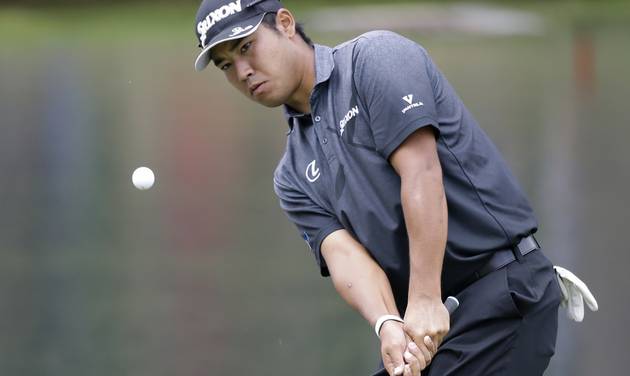 Hideki Matsuyama from Japan chips to the third green during the second round of the Bridgestone Invitational golf tournament at Firestone Country Club Friday