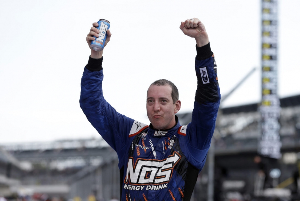 Kyle Busch celebrates after winning the NASCAR Xfinity Series auto race at Indianapolis Motor Speedway in Indianapolis Saturday