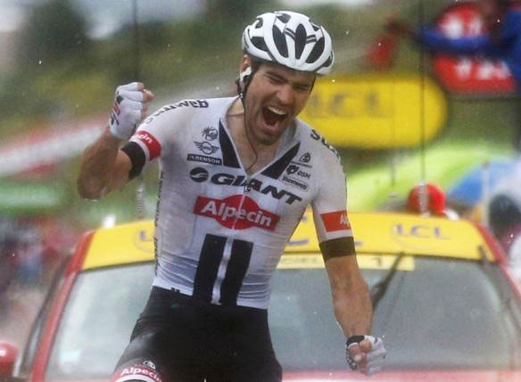 Stage winner Tom Dumolin of The Netherlands exults as he crosses the finish line