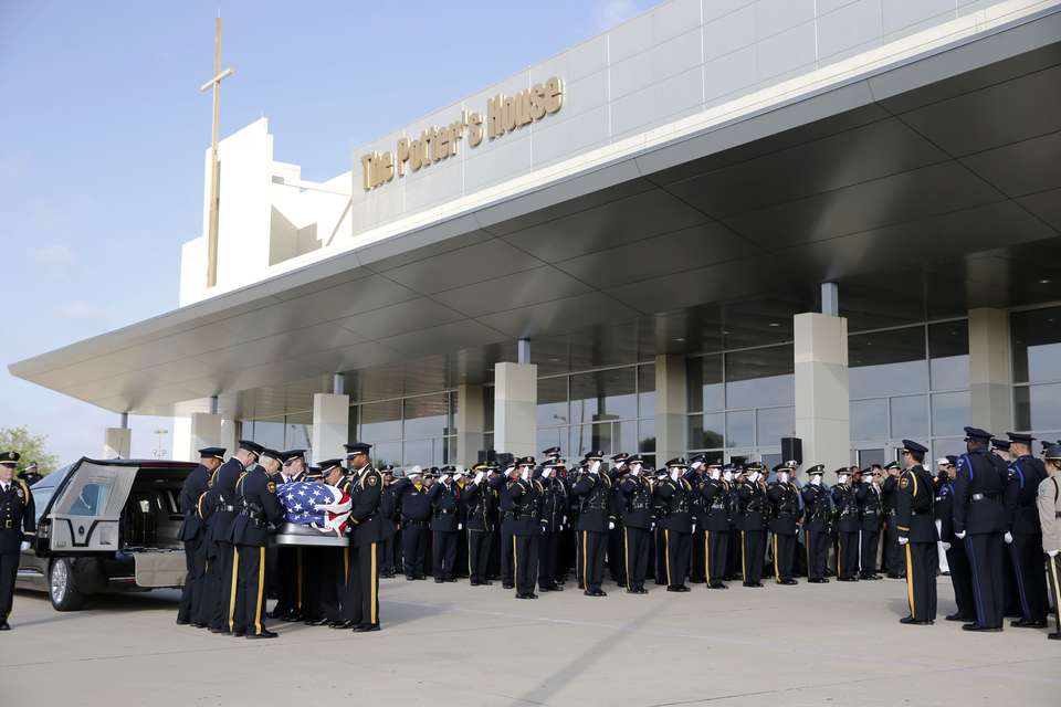 Thousands gather to mourn honor 3 slain officers in Dallas