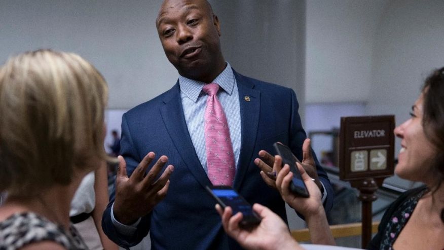 Sen. Tim Scott R-S.C. talks with reporters on Capitol Hill in Washington. Scott candidly described being stopped by police and Capitol Hill cops because of the color of his skin. It's an experience all too