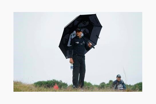 Zach Johnson of the United States watches his playing partners play from a rise on the 9th fairway during the second round of the British Open Golf Championships at the Royal Troon Golf Club in Troon Scotland Friday