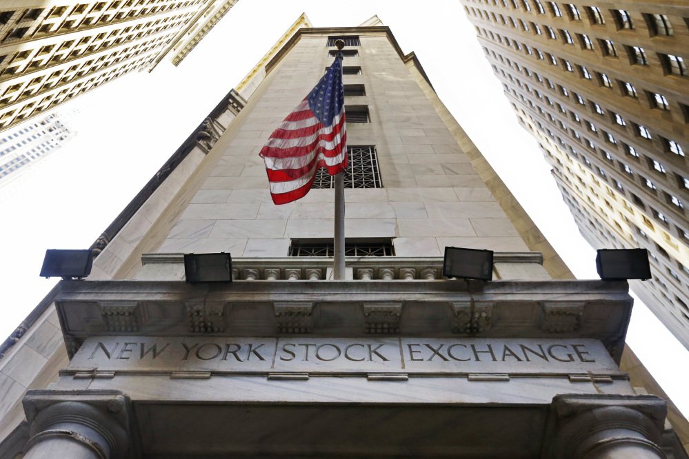 Stocks traded high on Wall Street on Tuesday with the Dow Jones industrial average closing at a record level