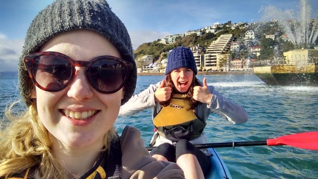 Lizzy Eden left and Kelsey Thomson kayaked out to the Oriental Bay fountain to capture it within Pokemon Go