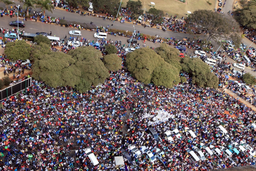 Thousands of Mugabe supporters gather at the party headquarters in Harare Wednesday July 20 2016. Tens of thousands of supporters of Zimbabwe's ruling party are marching in the capital in response to a series of recent protests against the govern