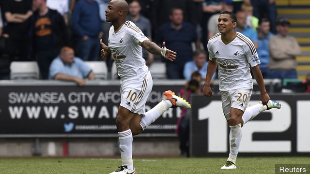 Andre Ayew celebrates after scoring the first goal for Swansea