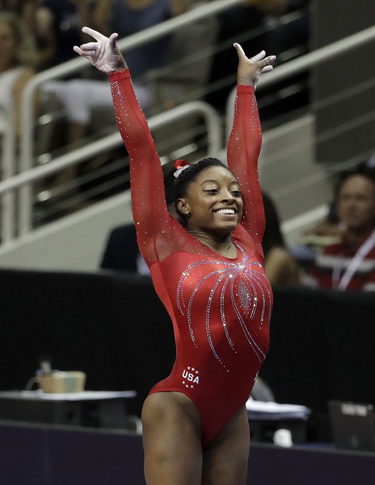 Simone Biles sticks her landing after her vault routine on her way to winning the Olympic gymnastics trials Sunday in San Jose California