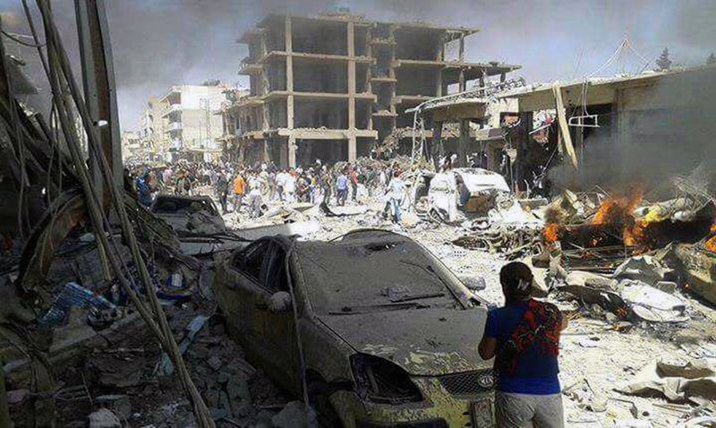 Syrian official news agency SANA Syrians inspect damages after deadly twin bombings struck the town of Qamishli Syria Wednesday