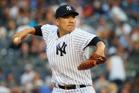 NEW YORK NY- JUNE 09 Masahiro Tanaka #19 of the New York Yankees pitches in the first inning against the Washington Nationals at Yankee Stadium