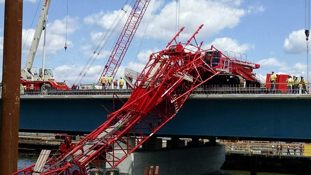 A giant crane sits on the Tappan Zee Bridge north of New York City after toppling around noon on Tuesday