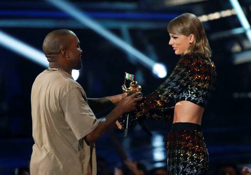 Taylor Swift presents the Video Vanguard Award to Kanye West at the 2015 MTV Video Music Awards in Los Angeles California