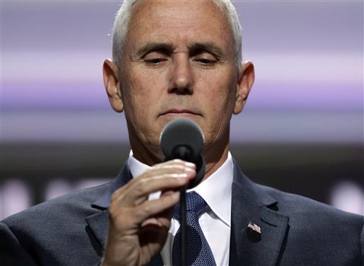 Vice Presidential nominee Gov. Mike Pence of Indiana adjusts the microphone on stage before the third day session of the GOP 2016 Convention Wednesday