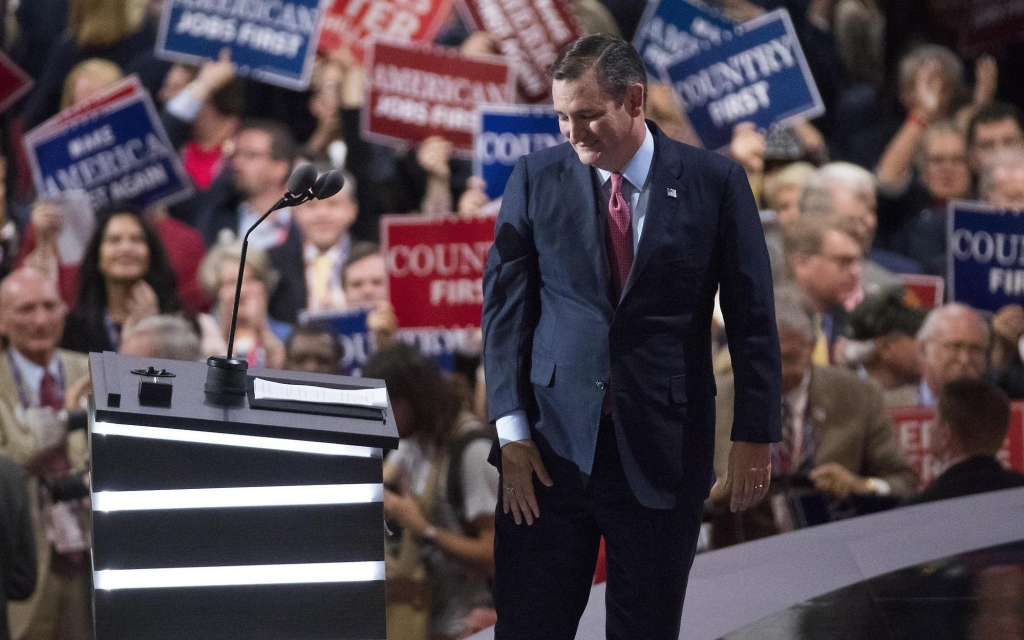 Sen. Ted Cruz walks from the podium after he was booed off the stage Wednesday night by supporters of Donald Trump for declining to endorse the GOP nominee