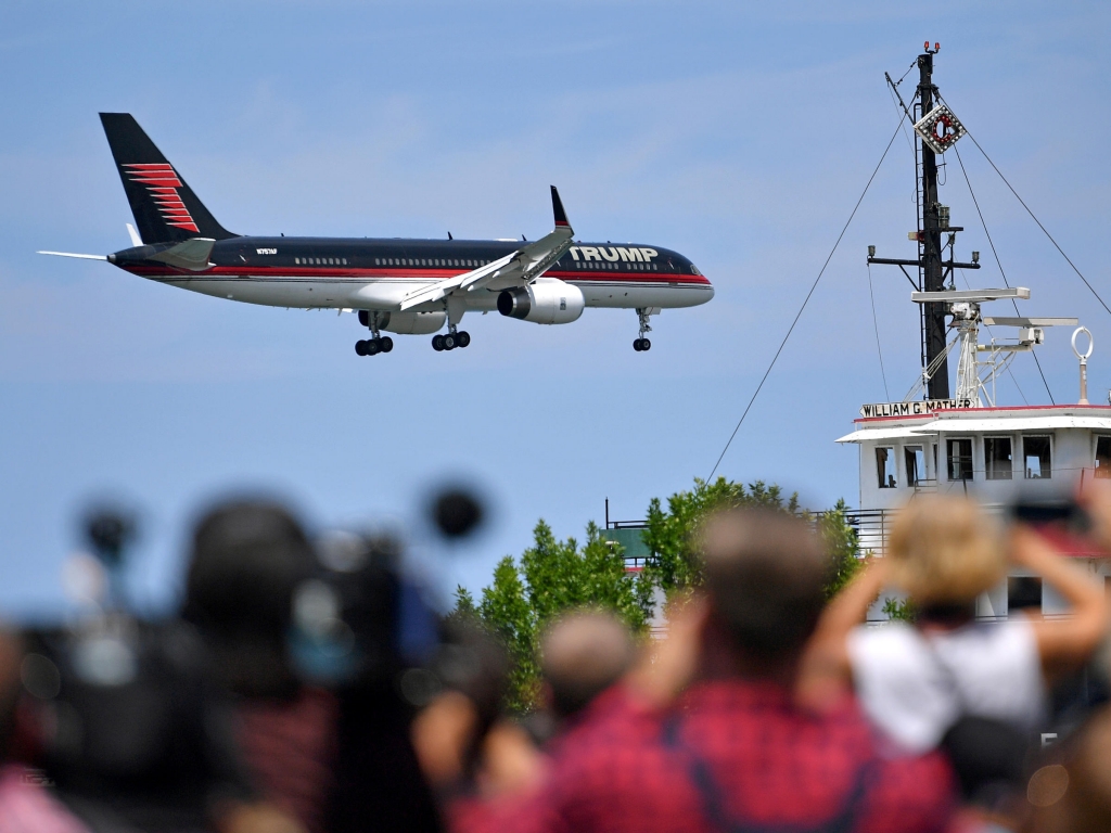 Donald Trump's plane arrives at a welcome event with Governor Mike Pence at the Great Lakes Science Centre on Wednesday in Cleveland