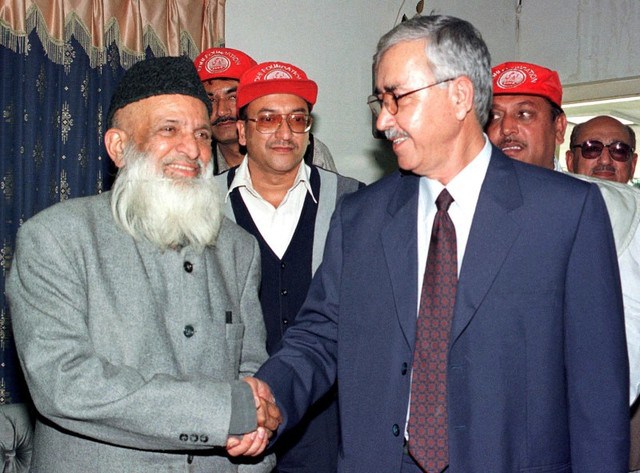 Rehmatullah Mosa Ghazi Charge d'Affaires at the Afghanistan Embassy, greets Abdul Sattar Edhi Pakistan social worker at the Afghan embassy in Islamabad Pakistan