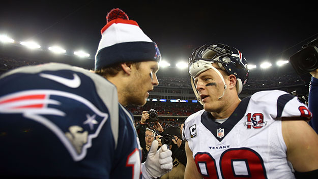 Tom Brady greets J.J. Watt of the Houston Texans after the 2013 AFC Divisional Playoff at Gillette Stadium