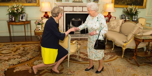 The Queen welcomes Theresa May at the start of an audience in Buckingham Palace London