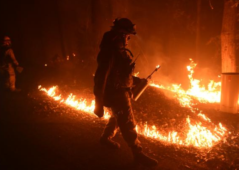 California engulfed by runaway wildfires