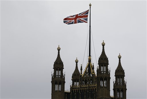 The Union flag flies above Parliament in London. AP