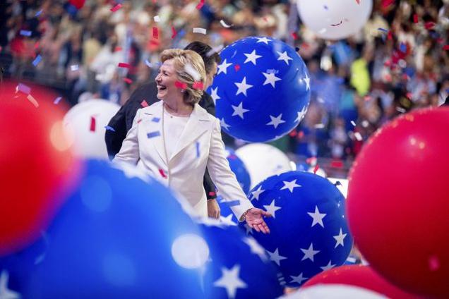 Democratic presidential candidate Hillary Clinton reacts to confetti and balloons as she stands on stage during the final day of the Democratic National Convention in Philadelphia Thursday